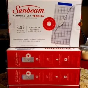 COPY - Sunbeam heating pads in the box, new